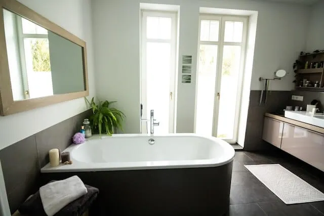 Bathroom-Remodel-black-floor-tiles-and-central-bath-tub Corpus Christi