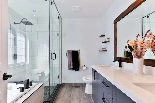 Corpus Christi Bathroom-Remodel-business-grey-cabinet-finish-with-wooden-framed-mirror
